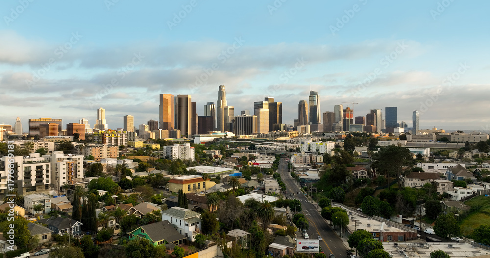 Fototapeta premium Los Angeles aerial panorama. LS city with architecture and blue sky. Drone photo of Los Angeles downtown skyline.