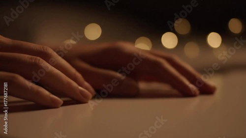 Wallpaper Mural Close Up Of Hands Resting On A White Surface With Soft Bokeh Lights In The Background Creating A Calm And Reflective Atmosphere Torontodigital.ca