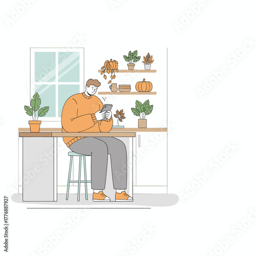 Cozy autumn scene man scrolls on phone in a modern kitchen setting