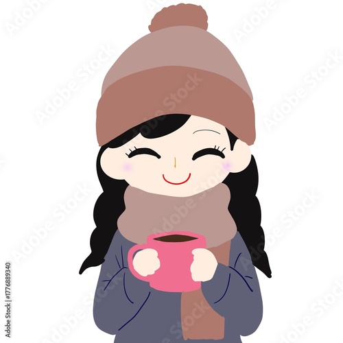女性がニット帽やマフラー姿でホットドリンクを持つシーン