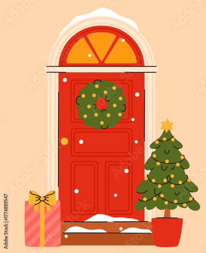 Red door decorated with a Christmas wreath.