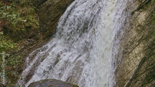 Waterfall in the mountains near alpine Lake Waegitalersee. Schraehbach waterfall or Schrahbachfall. Innerthal, Canton of Schwyz, Switzerland