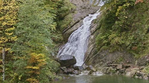 Waterfall in the mountains near alpine Lake Waegitalersee. Schraehbach waterfall or Schrahbachfall. Innerthal, Canton of Schwyz, Switzerland
