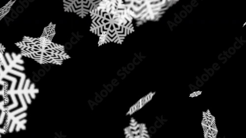Animated falling snowflakes on a black background. A simple winter animation representing Christmas, cold season, or festive atmosphere with soft, rotating snowflake motion. Alfa channel