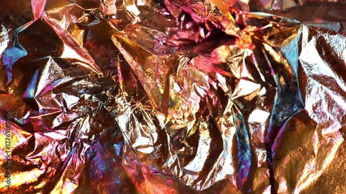 multicolored foil.Glittery multicolored mockup. Copy space. Shiny gradient shimmer foil background.Textured beautiful background. 4k footage