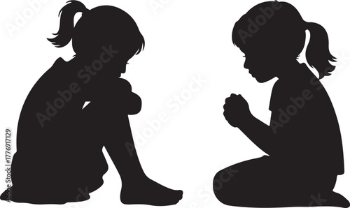 Two young girls in silhouette one sitting with knees to chest the other kneeling with hands clasped