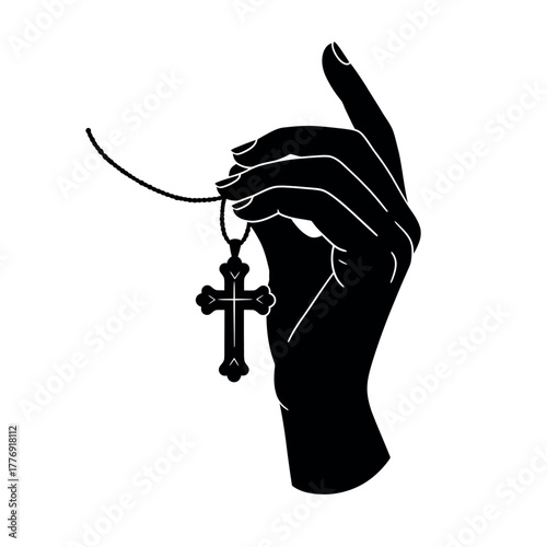 Silhouette of a hand holding a Christian cross necklace.