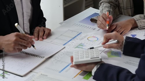 Business people collaborating on financial data analysis