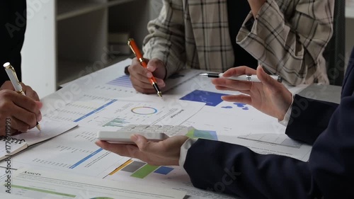 Business team collaborating on financial data report