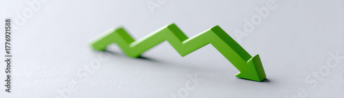 Green arrow graph showing decline and downward trend symbolizing economic or business decrease