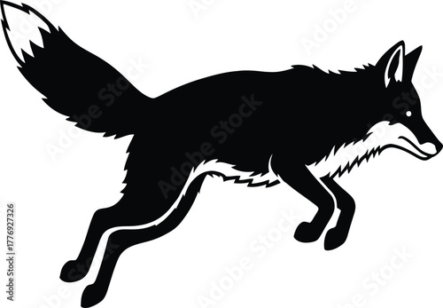 Black silhouette of a fox leaping with its tail held high jumping running