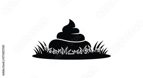 Black and white image of a pile of excrement in grass