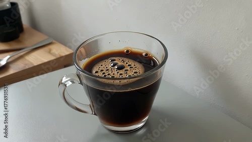 Overhead Shot of a Single Cup of Americano Coffee Arranged in a Flat Lay