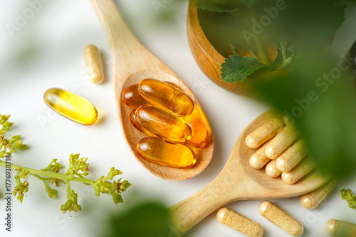 Medicine herbal organic capsule vitamin E omega 3 fish oil drug herbs leaf natural supplements