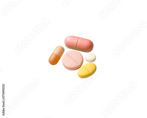 Various Colored Pills and Capsules on White Background