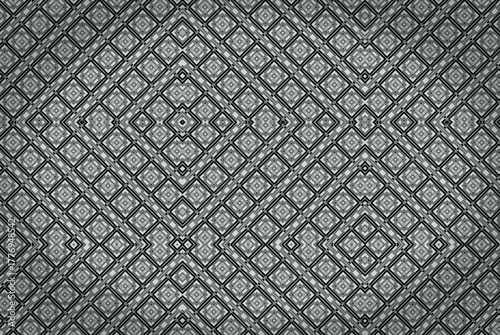Abstract geometric background featuring a seamless diamond-shaped pattern in shades of gray. The intricate, symmetrical design creates a modern, textured look.