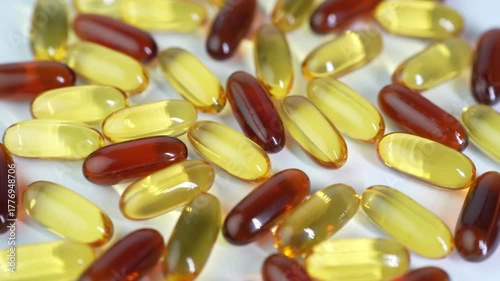 capsules mix softgel of food supplements, fish oil, omega 3, vitamin E, oval gelatin capsules