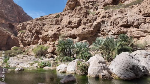 Wadi Ash Shab is a dramatic canyon in Oman famous for its hiking trail leading to emerald pools, a hidden cave, and a stunning internal waterfall.
