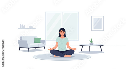 Woman meditating indoors seated on a rug surrounded by furniture in a minimalistic lightfilled room