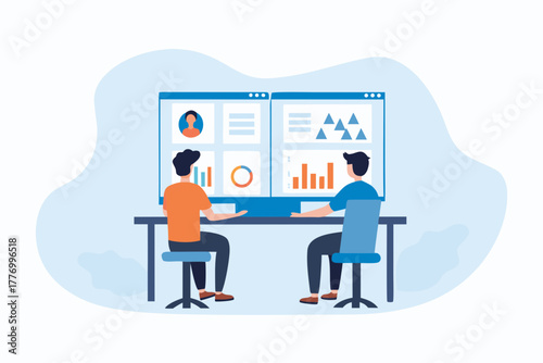 Two people collaborating at a desk analyzing data on a large computer screen with charts and graphs