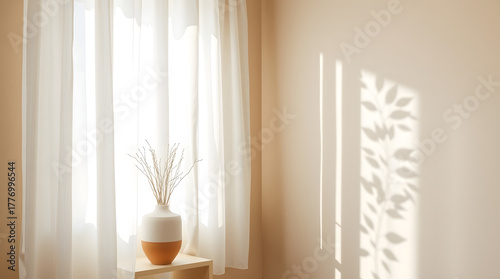 Natural light through sheer curtains casts dynamic plant shadows on a light wall, showcasing a minimalist vase with dried decor in a peaceful and bright home setting