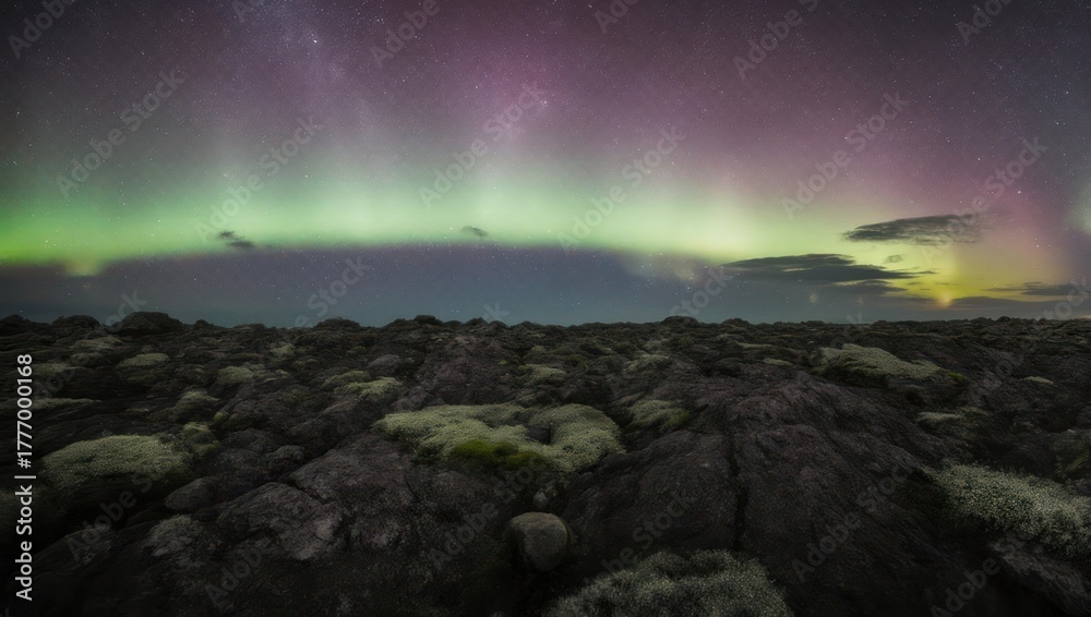 Naklejka premium Aurora Borealis over Icelandic Lava Field - A Night Spectacle.