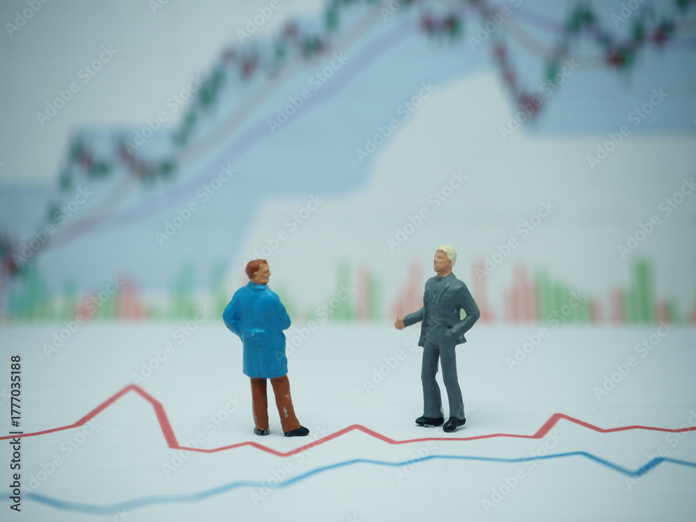 Fototapeta premium Mini toy of action figure at outdoor with blurred background. Toy photography concept design. Minifigure of businessman character with market graph.