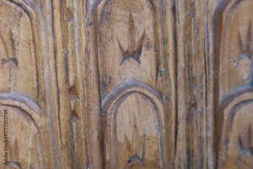 Fotografie Wooden door panel with carved design.