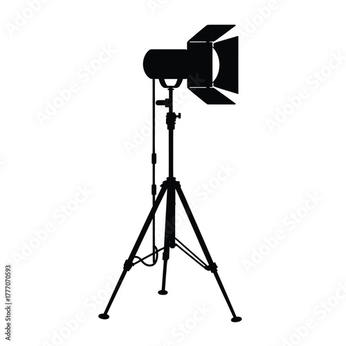 Silhouette of a professional studio lighting equipment on a tripod