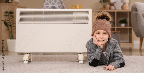 Cute little boy in warm hat...