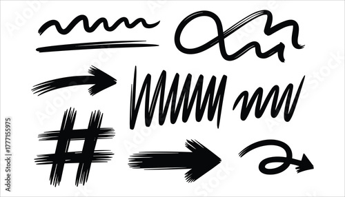Collection of black hand drawn brush stroke elements including wavy lines arrows and hashtag symbol white
