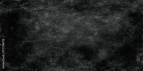 Dark grunge texture with scratched surface black vintage background for design, poster, or photography backdrop.