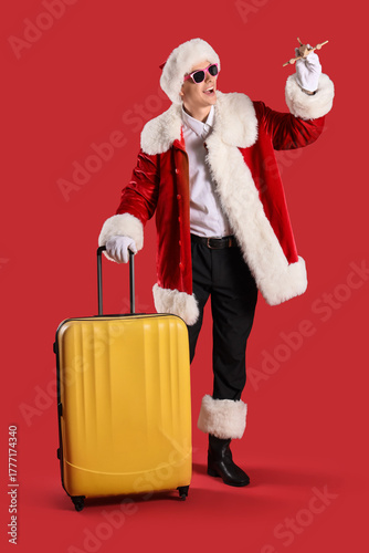 Young Santa Claus with wood...