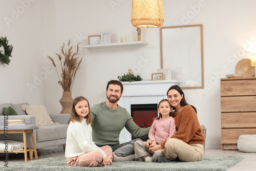 Portrait of young family at...