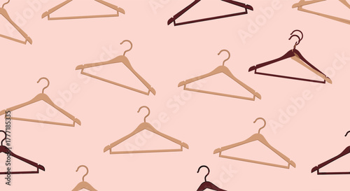 Seamless pattern of various colored clothing hangers on a light pink background, some layered, creating a stylish fashion backdrop.