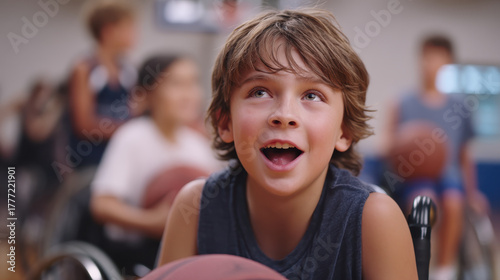 Wallpaper Mural Young boy in wheelchair joyfully participates in basketball game, surrounded by other children. scene captures sense of inclusion and excitement in sports setting Torontodigital.ca