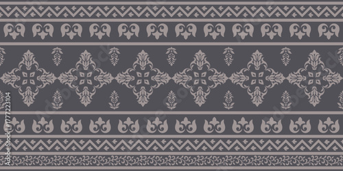 Ethnic pattern with symmetrical floral and geometric design in muted gray tones creating harmonious and elegant decorative textile style