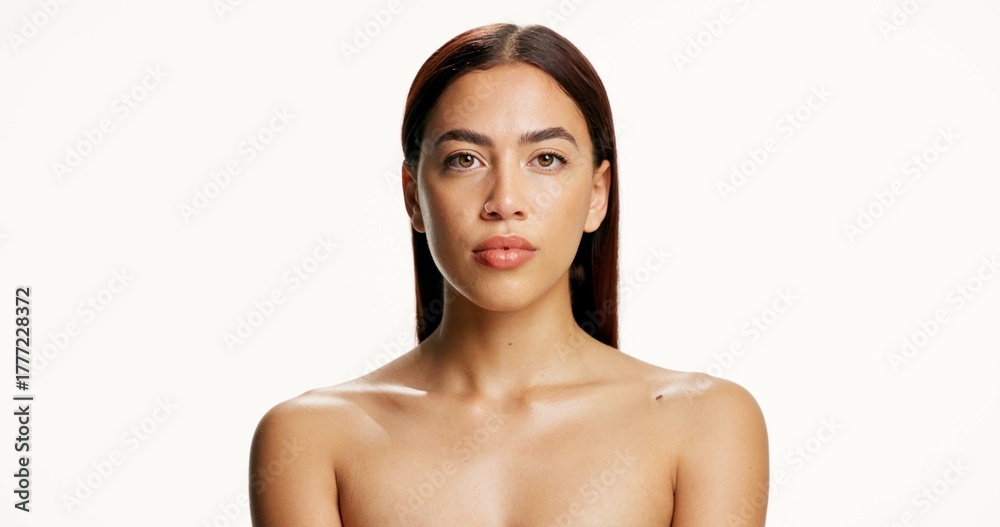Obraz premium Cosmetics, woman and skincare portrait in studio with natural beauty, healthy glow and hydration. Mockup space, girl or serious with dermatology on white background for collagen treatment or wellness
