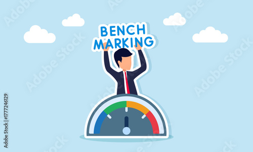 Businessman holding benchmarking text appearing from behind a speedometer or level meter illustration of business industry standard calculation