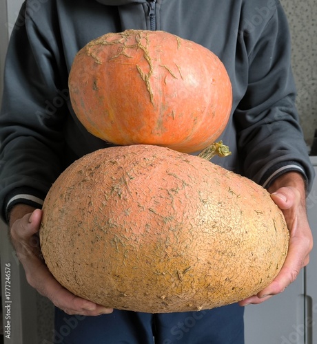 man holding pumpkin