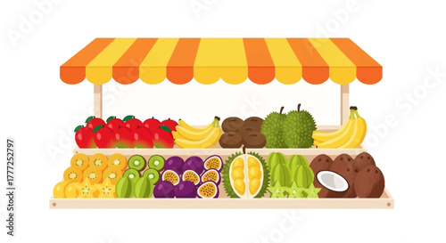 Fruit stand brimming with colorful produce under a striped canopy