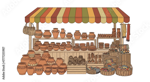 Market stand with pottery  artisanal items under striped awning