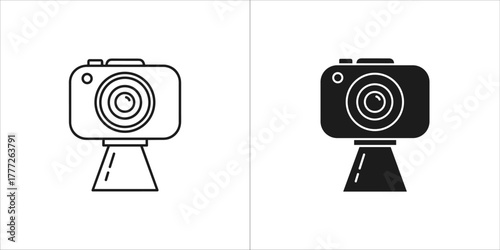 Line art and solid black icon of a digital camera on a stand