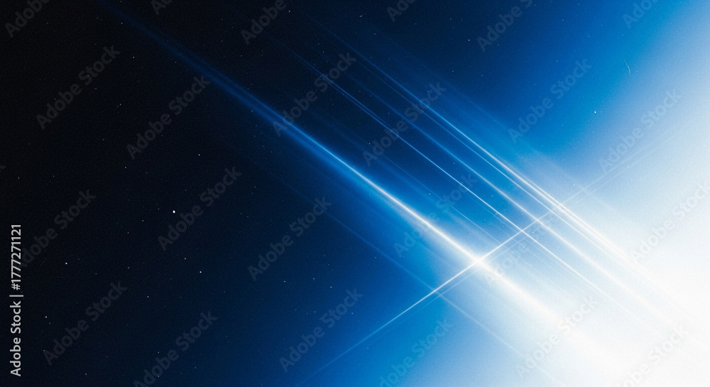 Fototapeta premium Abstract blue light streaks and particles against a dark starry background, representing speed and technology