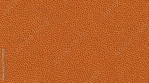 Orange leather texture with small pebbled grain pattern, seamless background for luxury fashion accessories and upholstery design projects.