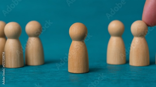 bullying, exclusion, rejection, discrimination, Workplace Harassment and Bullying Concept - Business Hand Pushing Toy Figure Off From Team Line with Copy Space.