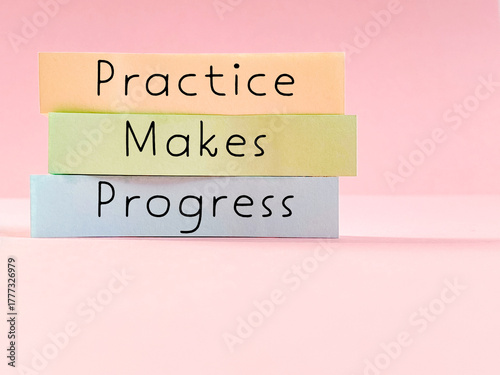 Practice makes progress text written on note paper with copy space background. Skills progression concept.