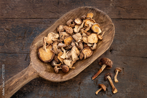 Dried shiitake mushrooms in the wooden bowl. 