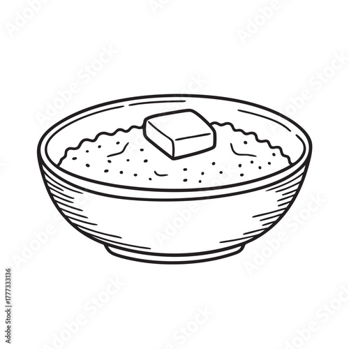 Bowl of warm grain porridge finished with melted butter