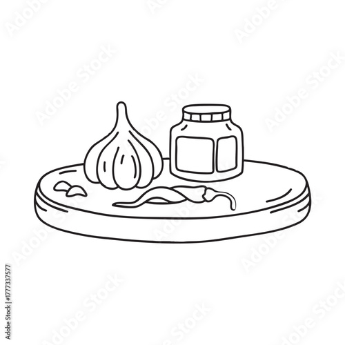 Wooden tray containing garlic paste and chili flakes